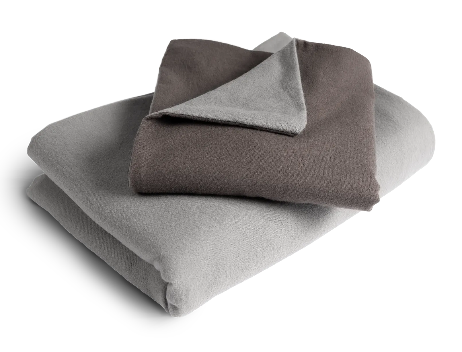 Le linge de lit BODYGUARD® en flanelle plié : la housse de couette est pliée avec la face grise vers l'extérieur, la taie d'oreiller avec la face couleur anthracite.