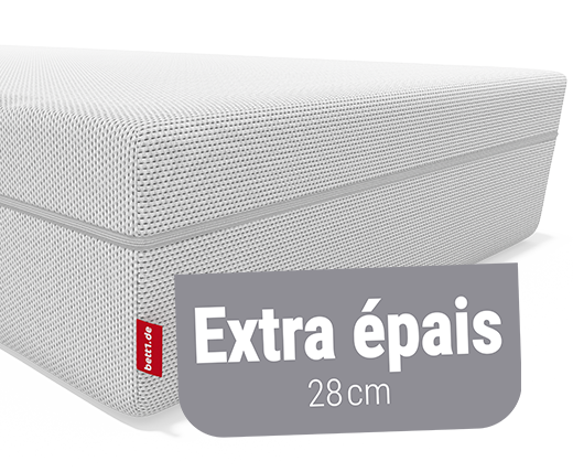 Coupe d’un matelas BODYGUARD® Boxspring montrant son noyau en mousse rouge, sans ressorts, avec le label "100 % mousse".