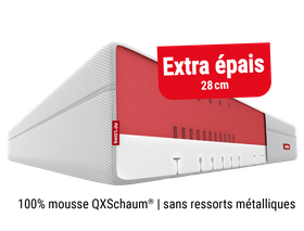 Coupe d’un matelas BODYGUARD® Boxspring montrant son noyau en mousse rouge, sans ressorts, avec le label "100 % mousse".