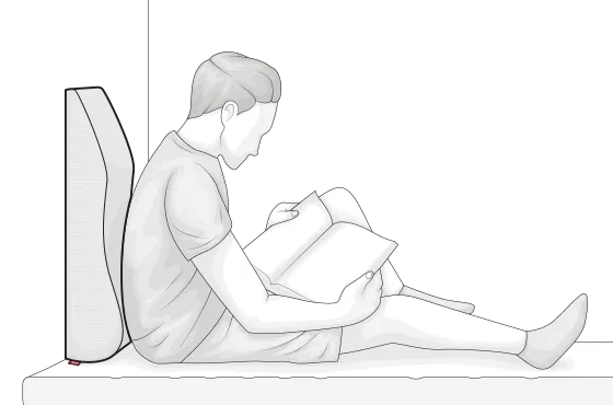 Illustration: une personne est assis et lit un livre, adossé à un repose jambes Bodyguard, placé à la vertical.