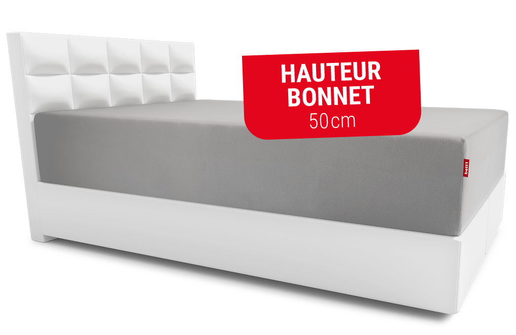 Lit avec un drap-housse BODYGUARD® sur le matelas Boxspring BODYGUARD®. Texte : hauteur bonnet 50cm
